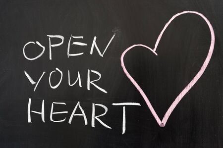 Open your heart concept drawn on chalkboardの写真素材