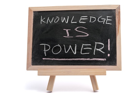&quot,Knowledge is power&quot, text written on blackboard over white backgroundの写真素材
