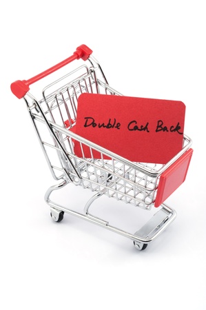 Double cash back words written on red paper card in shopping cart on white backgroundの写真素材