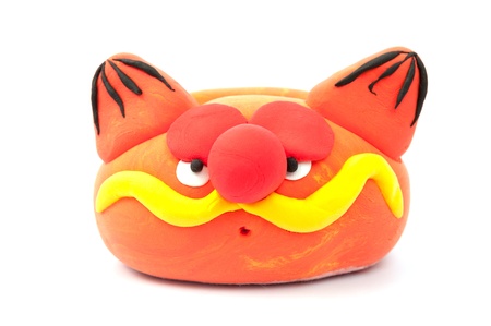 Painted pottery cat on white backgroundの写真素材