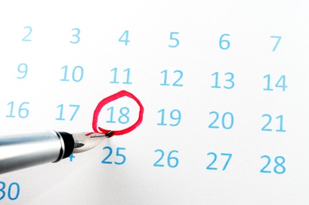 Red circle marked on a calendar with a penの写真素材