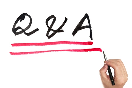 Q&A words with two lines written on white papen using penの写真素材