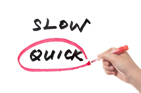 Choosing from Slow and quick, hand sketching on white boardの写真素材