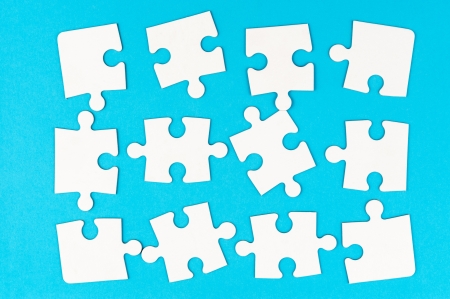 Group of white paper jigsaw puzzlesの写真素材
