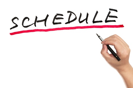 Hand writing Schedule word on white boardの写真素材