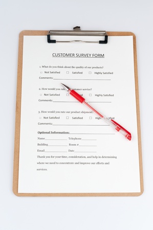 Customer survey form with a red pen on itの写真素材