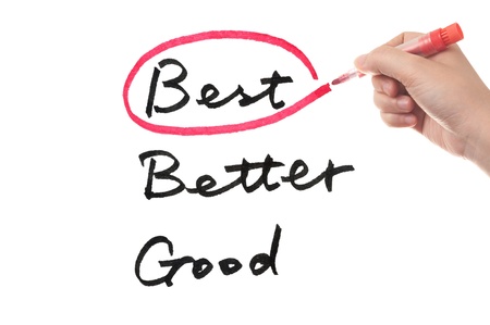 Choosing from good, better or best using a red pen on white boardの写真素材