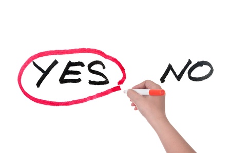 Choosing from yes and no concept, hand writing on white boardの写真素材