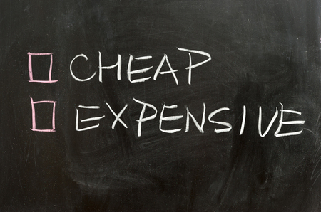 Cheap or expensive options on the chalkboardの写真素材