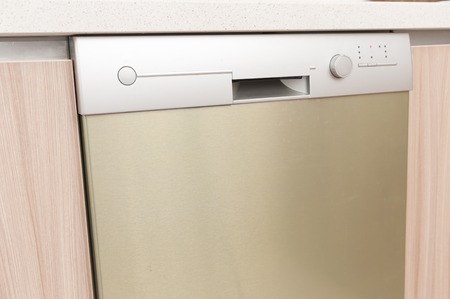Close up view of dishwasher in kitchen furnitureの写真素材