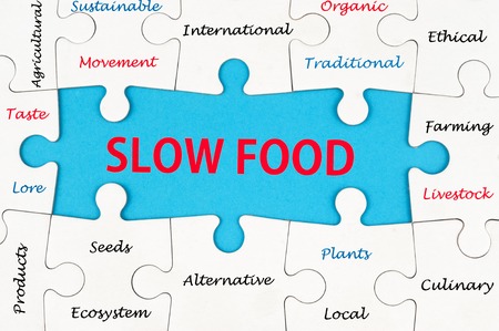 Slow food concept word cloud on group of jigsaw puzzle piecesの写真素材