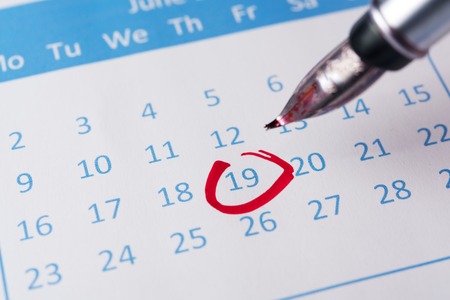Red circle marked on a calendar with a penの写真素材