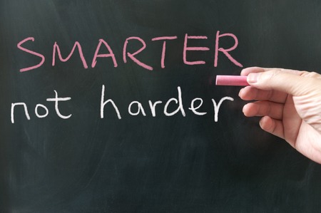 Smarter, not harder words written on the blackboard using chalkの写真素材