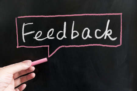 Feedback word and symbol  on blackboard using chalkの写真素材