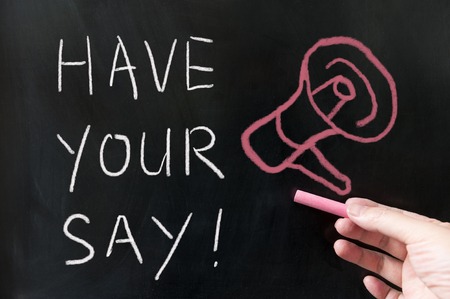 Have your say words written on blackboard using chalkの写真素材