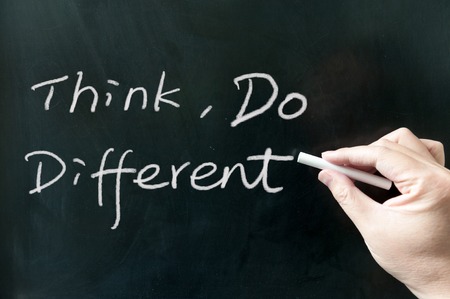 Think, do different words written on the blackboard using chalkの写真素材