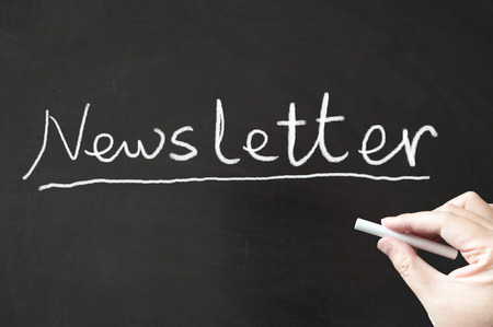 Newsletter word written on the blackboard using chalkの写真素材
