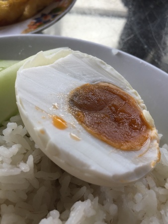 Salted egg with rice served on a plate for lunchの素材