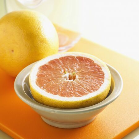 Whole and Halved Grapefruitの写真素材