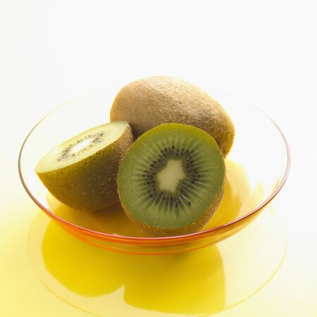 Halved and Whole Kiwi Fruitの写真素材