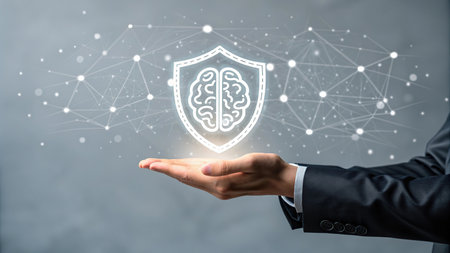 Close up of businessman hand holding digital brain and shield with connection lines conceptの素材