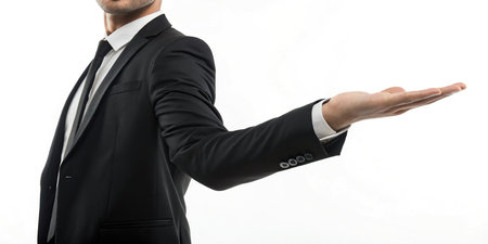 Businessman in black suit holding something on the palm of his handの素材