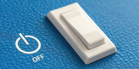 Close up of white power button on blue leather background. Selective focus.の素材