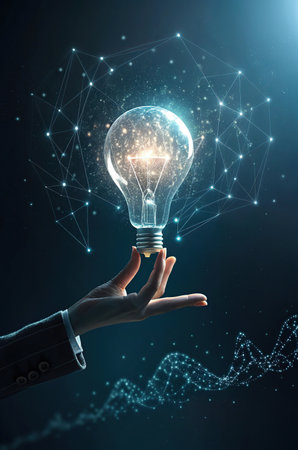 Close up of businessman hand holding light bulb on dark background. Idea conceptの素材