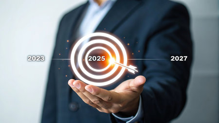 Businessman hand holding a target with 2020 goals. Business success concept.の素材