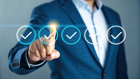 Businessman pressing check mark button on virtual screen. Business and technology concept.の素材