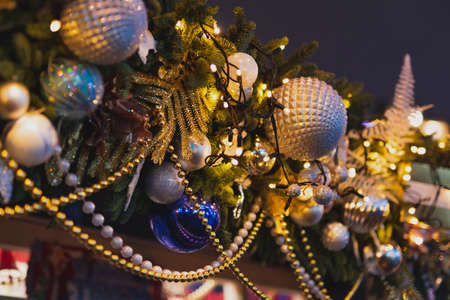New Year decorations. Closeup Christmas lights and balls on the streetの写真素材