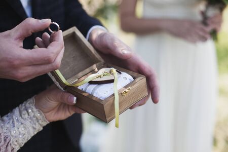 Wedding couple exchanging the rings.