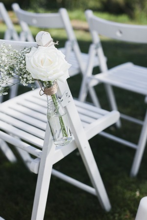 Wedding exit registration, white chairs decorated for wedding.の写真素材