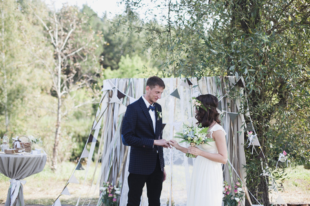 Young happy wedding couple at exit registration.の写真素材