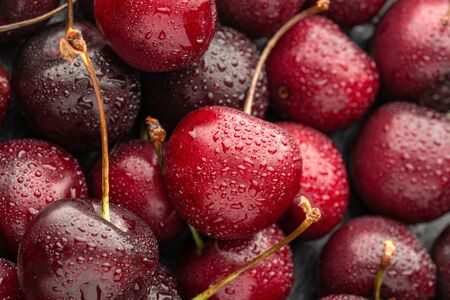 Close up of ripe cherries with Large collection of fresh red cherries. Ripe cherries background.