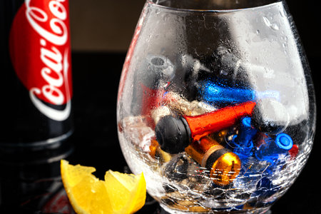 Consumables for tire repair, new multi colors nipples for car tires. tire valve , Clamp-in Tubeless Tyre Tire Wheel Schrader Valves. Black background. a glass of coca colaのeditorial素材