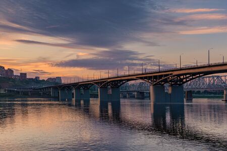 Bridge over the Yenisei river, evening sunset. Krasnoyarsk, Russia. panorama of the evening cityの写真素材