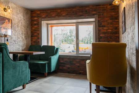 Krasnoyarsk, August 20, 2019: coffee shop DISCOVERY interior and decoration: tables, chairs, lounge areas in the loft-style barのeditorial素材