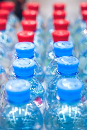 Rows of water bottles, clean drinking water, beautiful backgroundの写真素材