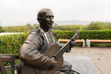 Krasnoyarsk, Russia, August 25, 2019: man playing guitar, street monument, landmark, places for tourists and loversのeditorial素材