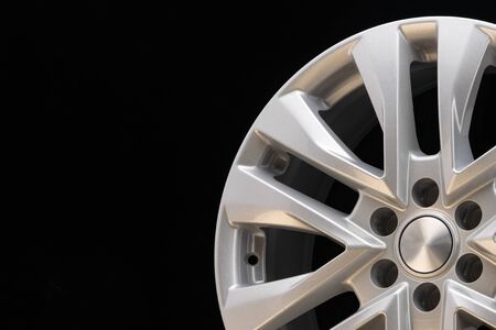 new powerful silver aluminum rim wheel for suv cars original on black background . beautiful...