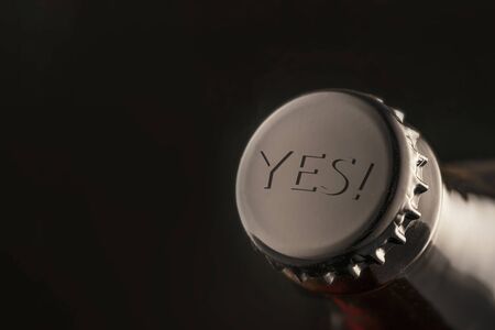 yes-the label on the cork of a beer bottle or soda. positive resolution sign. for menu and bar design, advertising concept. Dark backgroundの写真素材