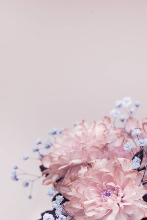 flowers, close-up of pink, pale pink chrysanthemums and small lilac flowers, bouquet composition. vertical photo. copy spaceの写真素材
