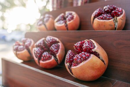 juicy fruits of ripe pomegranate without peel, berries Shine in the sun. Street trading in Thailand.の写真素材