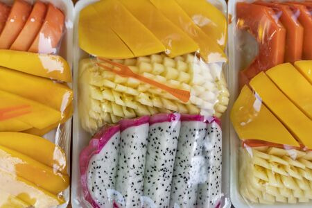 sliced Thai fruits meats in a package under placeu closeup. Delicious vegetarian Breakfast.