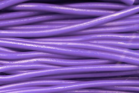 abstract background of lines or stems that look like wires, violet and pink color, blur.