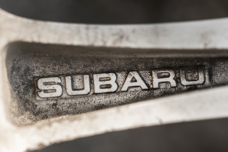 subaru - the logo of the automobile company, engraved on the spoke of the original aluminum alloy wheels close-up. old loft inscriptionのeditorial素材