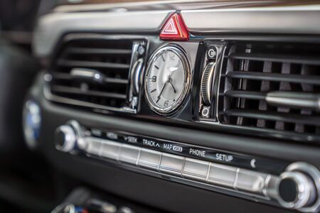 analog clock in the car interior