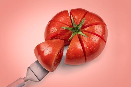 tomato cake, a piece of tomato on a cake spatula. concept on a pink backgroundの写真素材