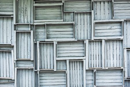 a wall of gray wooden boxes, a concept design and decoration of country houses in the loft style